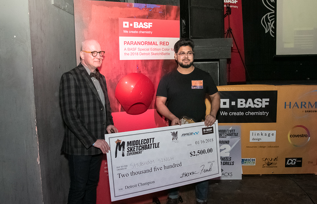 Singh receiving check